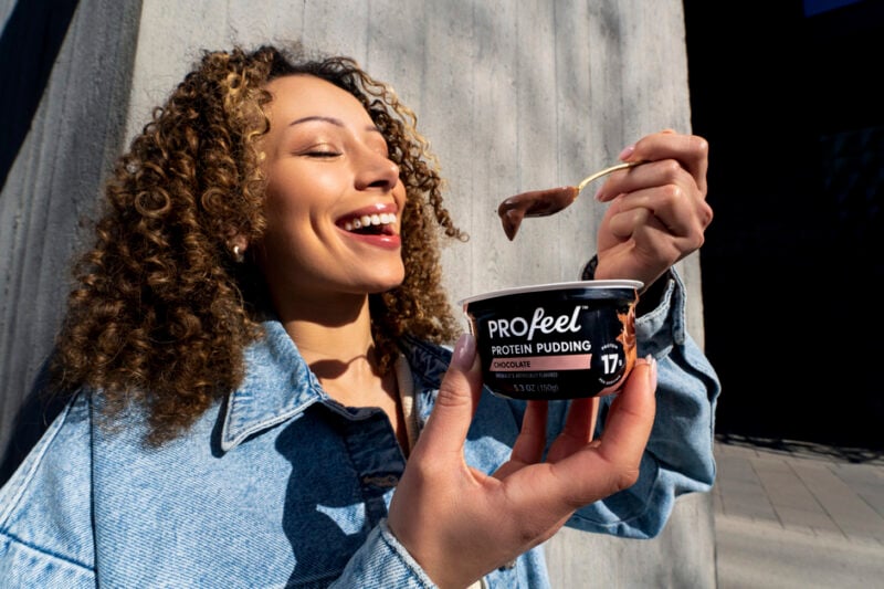 Woman enjoing PROfeel protein pudding